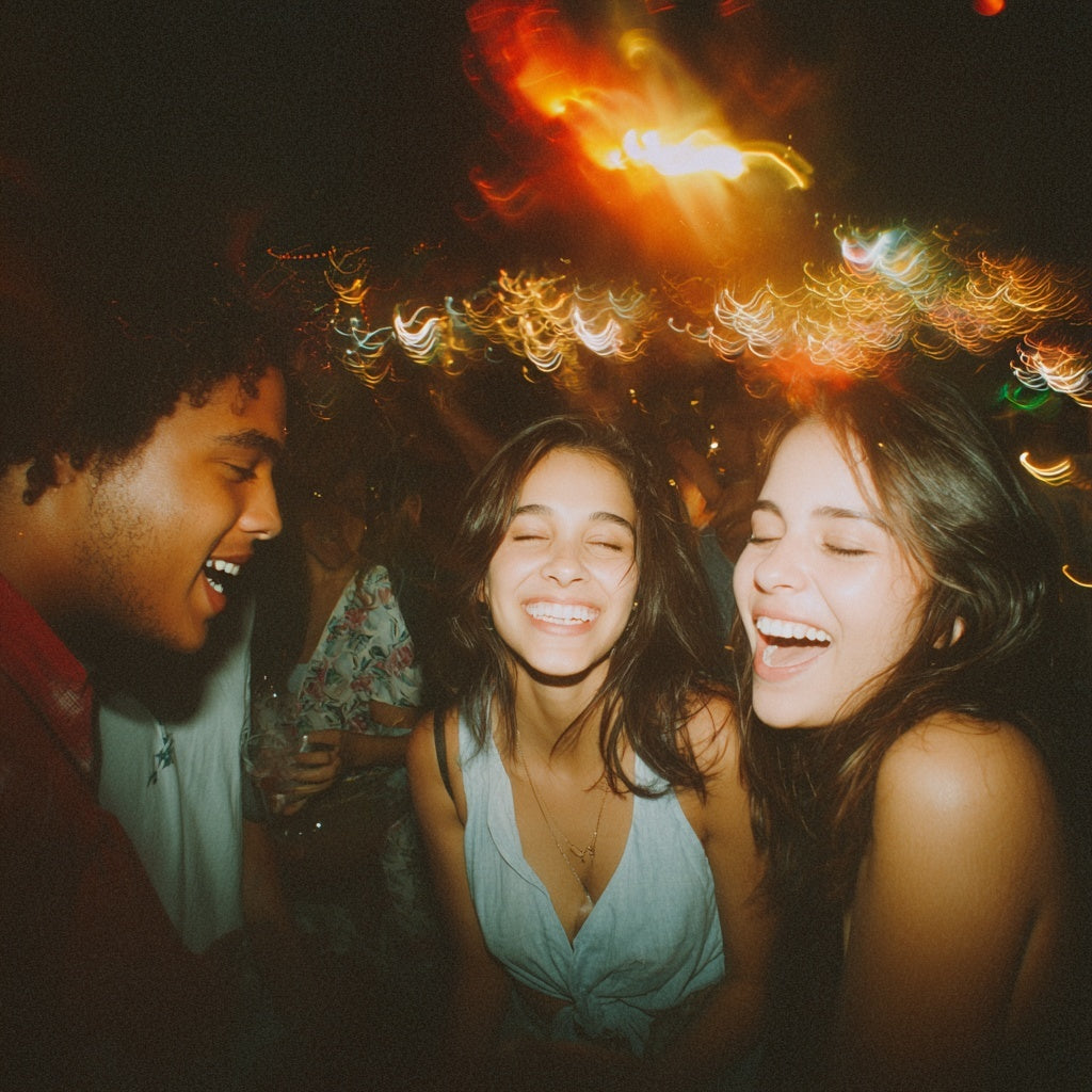 Three friends laughing together on a night out